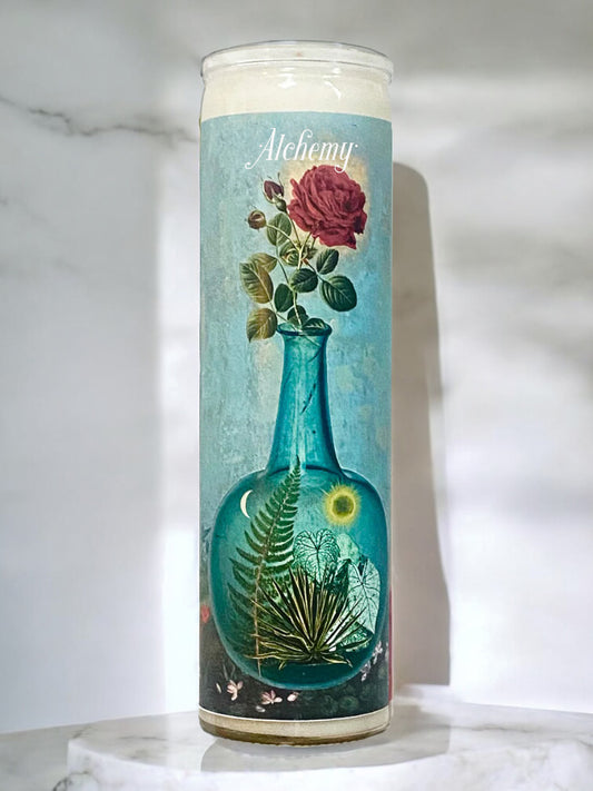 Candle with floral design on a white marble surface