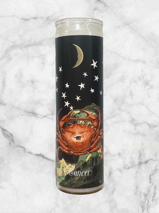 Candle with astrological design on a marble background
