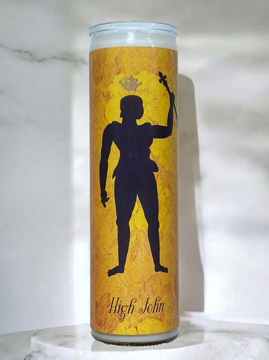 Candle with a silhouette design on a yellow background