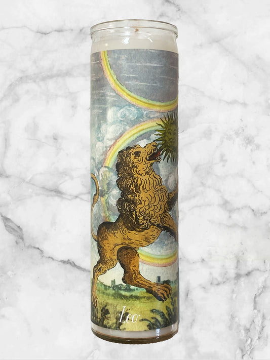Candle with a design of a lion and rainbow on a marble surface
