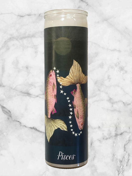 Candle with Pisces zodiac design on a marble background