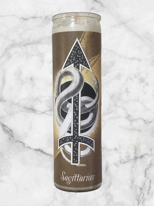 Candle with Sagittarius symbol design on a marble background
