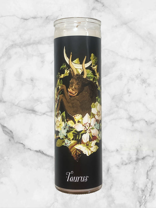 Candle with Taurus design on a marble background