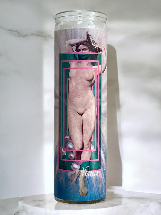 Candle with a printed design of a nude figure on a marble surface