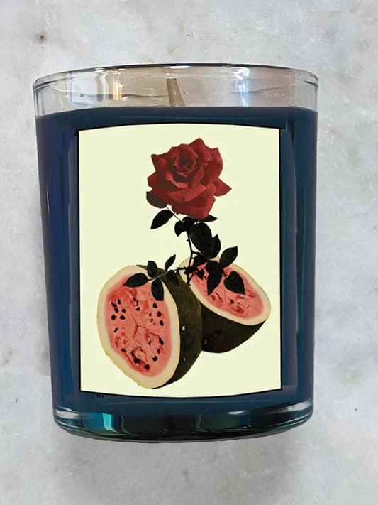 watermelon and rose design on candle with marble background.